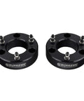 Keep Your Pickup Tight And Lifted With This 3 Inch Front Leveling Kit Built For Chevy Silverado 1500 And GMC Sierra 1500 Trucks Using Rugged T6 Billet Aluminum Strut Blocks That Smooth Out The Dash And Make Weekend Trails Feel Like A Dream Cruise, featuring two black T6 billet aluminum strut blocks with precision machined details.