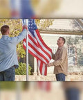 Two people installing Defender Inground Flag Pole Kit Built Tough For Outdoors With Winds Up To 130 MPH Dual Flag Pole Holder