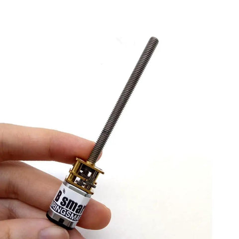 Person holding Mini DC Gear Motor with Threaded M4 Shaft 55mm All Metal Gears N20 Size 3V 6V 12V High Torque Micro Electric Screw Reducer