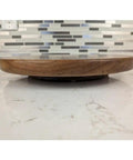 Side view of 12 Inch Walnut Lazy Susan Turntable Serving Tray with Non Slip Rotating Base on kitchen countertop