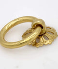 Close-up of a vintage gold brass ring pull with hollow dome base, flower-like design, part of a Set Of 6 Vintage Gold Brass Ring Pulls.