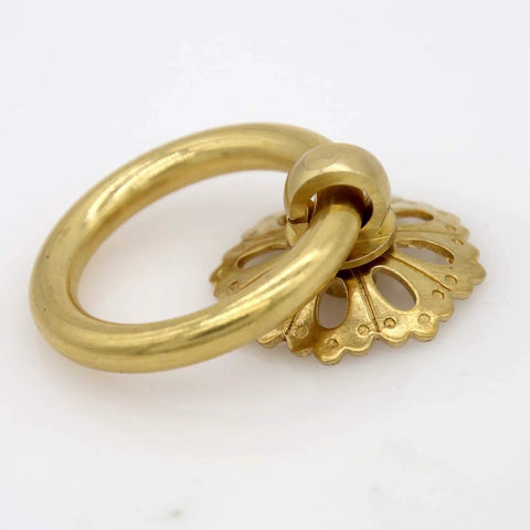 Close-up of a vintage gold brass ring pull with hollow dome base, flower-like design, part of a Set Of 6 Vintage Gold Brass Ring Pulls.