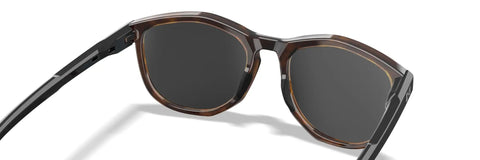 Top Shelf Shatterproof Sunglasses And Work Safety Shades Featuring Premium Polarized Grey Lenses For Men And Women Encased In A Dope Gloss Tortoise Build Packing Serious Uv Defense, angled view showcasing the frame.