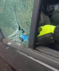 resqme emergency car escape tool - side view of vehicle with broken window