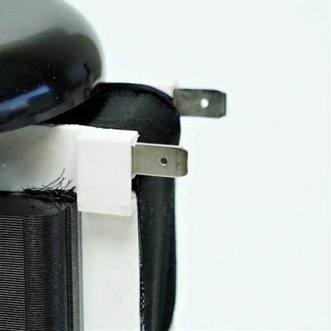 Close-up of the furnace draft inducer assembly replacement motor designed for Carrier units, showcasing electrical terminals.