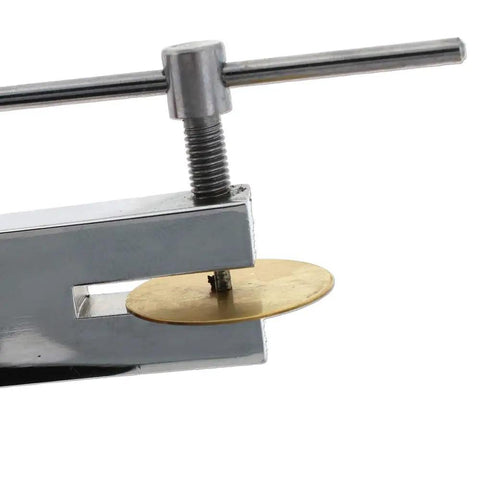 Dual Tip Hole Punch Tool 1.5mm And 2mm in use on metal sheet, pro grade for jewelry making, leather craft, and DIY projects.