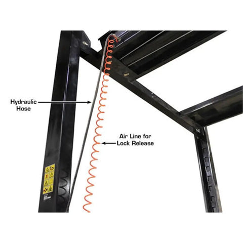 Hydraulic hose and air line for lock release on Weekend Warrior 4 Post Car Stack Lift, demonstrating safety features.