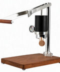 Portable Manual Espresso Maker With Stainless Steel Lever And Precision Pressure Gauge For Rich Extraction Of Espresso And Latte Road Ready Build Delivers Straight Up Quality Shots And Real Deal Flavor Everyday on wooden base.