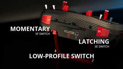 Boxer Max Transmitter Remote for RC Drones with Carbon Fiber Pattern Case top view, showing momentary and latching switches.