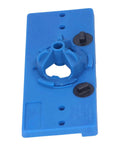 Front view of blue ABS hinge hole saw drilling guide jig; blue base with two black adjustment knobs