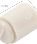 Close-up of a single lightweight plastic needle tip stopper measuring 1cm by 0.5cm, shown against a white background.