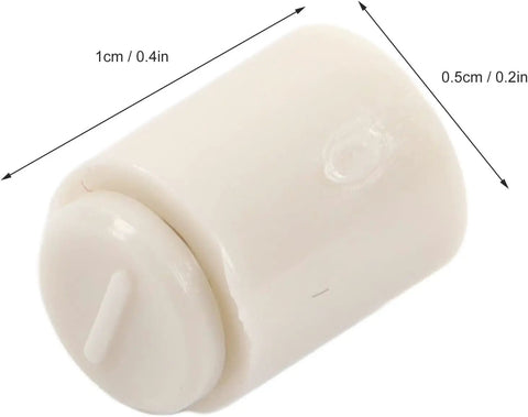 Close-up of a single lightweight plastic needle tip stopper measuring 1cm by 0.5cm, shown against a white background.