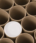 Solid As A Rock Kraft Mailing Tubes For Shipping And Storage Extra Strong Spiral Wound Design With Tight End Caps Made Right Here In USA, brown kraft tubes arranged with one white cap visible.