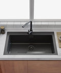 3-1/2 Inch Kitchen Sink Drain Assembly With Removable Strainer Basket Stopper Matte Black Finish, installed in a modern kitchen sink