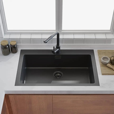 3-1/2 Inch Kitchen Sink Drain Assembly With Removable Strainer Basket Stopper Matte Black Finish, installed in a modern kitchen sink
