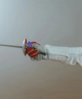 Fencer gripping an epee with Dual Pack Pro Gear Electric Epee Wire Replacement Set for Fencing.