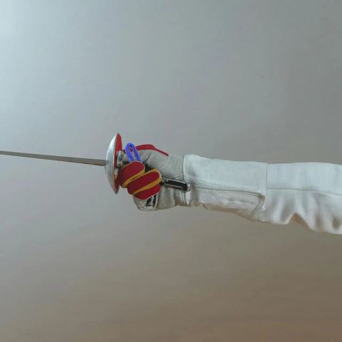 Fencer gripping an epee with Dual Pack Pro Gear Electric Epee Wire Replacement Set for Fencing.