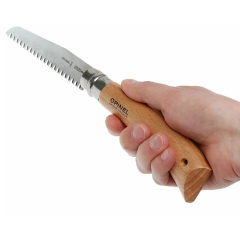 Badass Lightweight Folding Saw For Weekend Campouts And Garden Grind Cuts Branches Fast With Razor Sharp Carbon Steel Blade Secure Virobloc Lock And Natural Beechwood Handle held in hand.