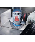 Street Tough 4.5 Inch Angle Grinder Featuring X Lock Tool Free Disc Swap Mount in action on metal surface.