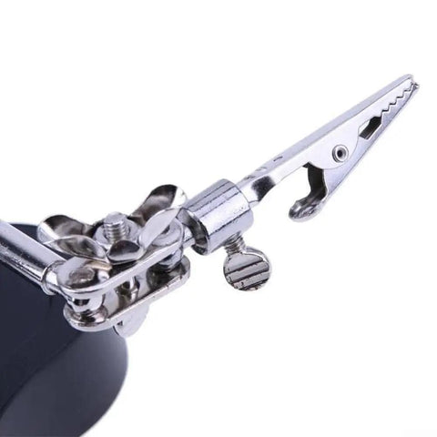 Close-up of sturdy alligator clip on Desktop LED Magnifying Glass Soldering Station with dual 3.5X and 12X magnification.
