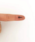 Black Tiny Screw Eye Pins Hooks For Jewelry Making And Craft Projects 250 Pcs Small Eyelets shown on finger for scale