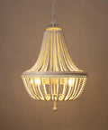 Wood Bead Chandelier Light Fixture in White Finish Farmhouse Bohemian 4 Light Empire Pendant glowing in dim dining room.