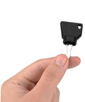 Hand holding one of the 10 Pack Ignition Starter Keys For Heavy Equipment Pros, designed for skid steer, and loader, heat-resistant key.