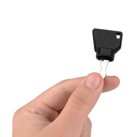 Hand holding one of the 10 Pack Ignition Starter Keys For Heavy Equipment Pros, designed for skid steer, and loader, heat-resistant key.