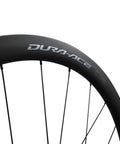 Close-up of Dura-Ace Wh-R9270 C36 Carbon Road Wheelset 700c Tubeless Ready With 36mm Aero Depth rim detail.