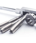 10 Piece Metric Tap Set For Clock And Watch Making, Hand Taps M1 To M3.5 on white surface, close-up of threading bits.