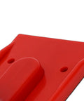 Close-up of a red Hardcore Jointer Push Block For Bulletproof Safety Cuts with textured grip for woodworking safety.