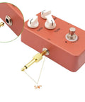 Gold Plated 1/4 Inch Guitar Pedal Connectors 6 Pack, male to male straight plugs attached to a guitar pedal for easy cable management.