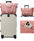 Expandable Travel Tote Bag With Trolley Sleeve And Wheels on suitcase, waterproof pink oxford, pocket holding phone