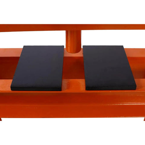 Heavy Duty 12 Ton Hydraulic Shop Press With Portable H Frame's black work table pads for secure component support.
