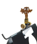 Serious Rooftop Fire Defense Sprinkler System That Stops Wildfire Embers Cold with a compact black base and gold sprinkler head.