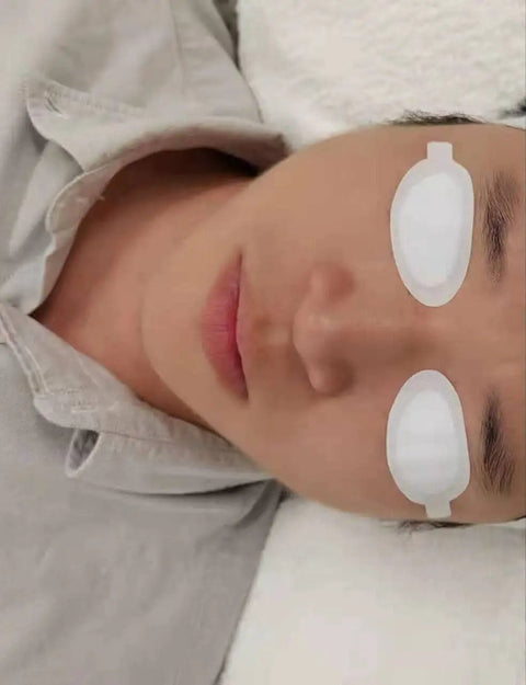 Premium Disposable Laser And Ipl Led Eye Shields Pro Grade Cosmetics Safety Pads Od7 Uv Blocking Heavy Duty Spa Facial Treatments 50 Pairs Black Straight Up Client Protection on a client during a facial.