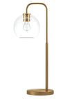 Lit 27 Inch Tall Arc Table Lamp With Clear Glass Globe Shade And Brass Accents Handcrafted Steel Base Modern Yet Classic