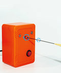 Compact Bobber Painting And Polishing Machine Kit for DIY fishing lures with orange casing and black wire, side angle view.