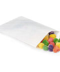 White Paper Candy Bags 1/4 Lb Capacity 4 3/4 Inch By 6 3/4 Inch Glassine Lined Moisture Resistant Food Safe 500 Count Perfect For Nuts Candies And Snacks, image showing candy spilling out.
