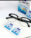 Lens Wipes anti-fog wipes; front view of black-framed eyeglasses with blue and white packaging in the background