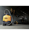 20V Lithium-Ion Battery Powered Backpack Sprayer Tool Only 4 Gallon Tank Workhorse next to power tools in storage area