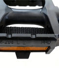Close-up of Extra Wide Bike Pedals With Toe Clips And Straps, Nine Sixteenths Inch Oversized Platform with reflective strip.