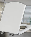 Straight Up Premium Universal White Toilet Seat With Foolproof Soft Close Slow Drop Lid Crafted From Heavy Duty Urea Resin That Blocks Scratches And Never Turns Yellow, angled view showing smooth lid and quick release fittings.