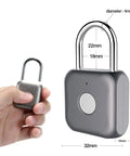 Gray metal fingerprint padlock keyless lock for lockers backpacks gym bags and luggage with dimensions and hand holding device.
