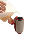 Premium Flocked Paint Roller Edger Tool for Walls and Trim being filled with paint from a container.