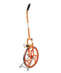 Rock Solid Steel Measuring Wheel With Smooth Rolling Plastic Tire And Dead On Mechanical Clicker Counter, orange color, sturdy design for outdoor use.