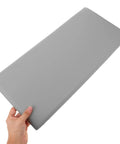 Rock Solid Premium Peel And Stick Xpe Foam Wall Pads in hand, soft gray XPE foam for nursery safety and protection.