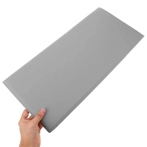 Rock Solid Premium Peel And Stick Xpe Foam Wall Pads in hand, soft gray XPE foam for nursery safety and protection.