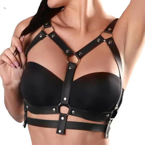 Adjustable Black Leather Chest Harness And Waist Chain Belt For Rave Festivals Nightclub Wear Sexy Belly Bra Streetwear Accessory For Women Serving That Baddie Energy. Close-up of chest harness with metal clips.