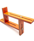 Adjustable Battery Spot Weld Jig For 18650 And 26650 Cells With Flexible Array Layout, orange Bakelite design, adjustable height.